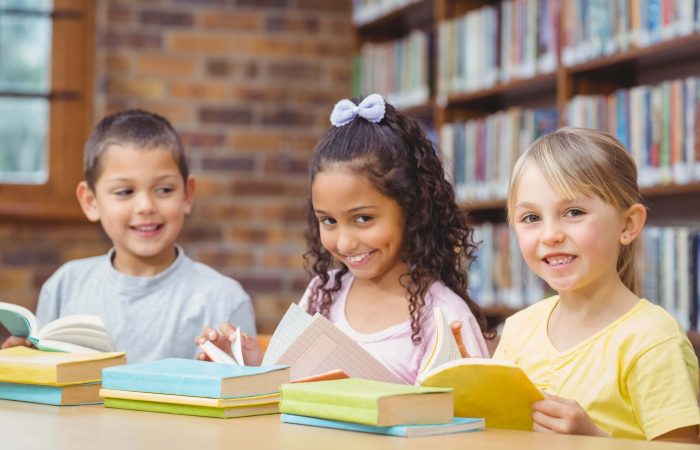pupils-reading-books-library-min
